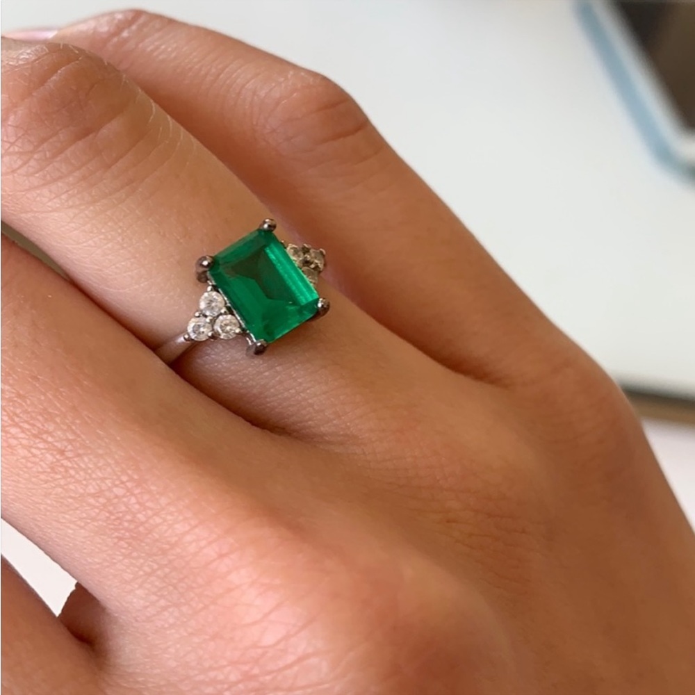 Three stone emerald cut ring